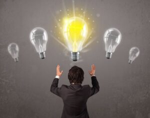 business person having an bright idea light bulb concept